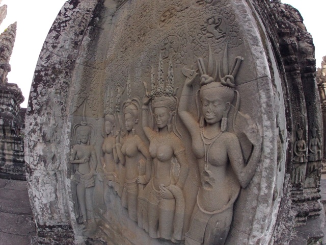 Intricate carvings of women adorning the ancient walls left me breathless. And I could get right next to them and see all the detail. Top level of Angkor Wat.
