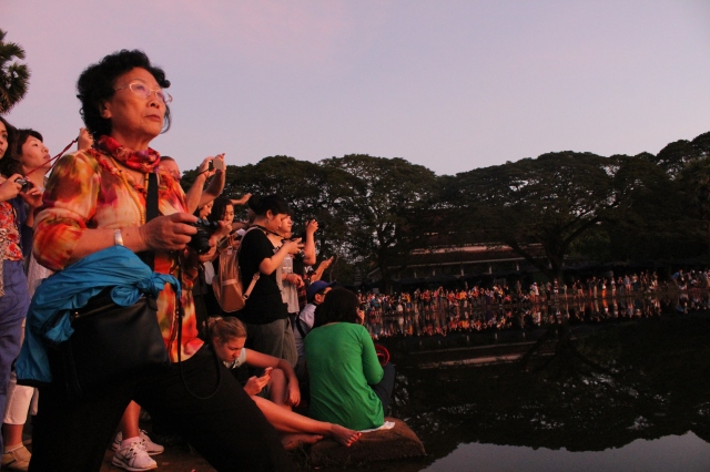 Angkor Wat attracts tons of tourists to see the sun rise over the temples