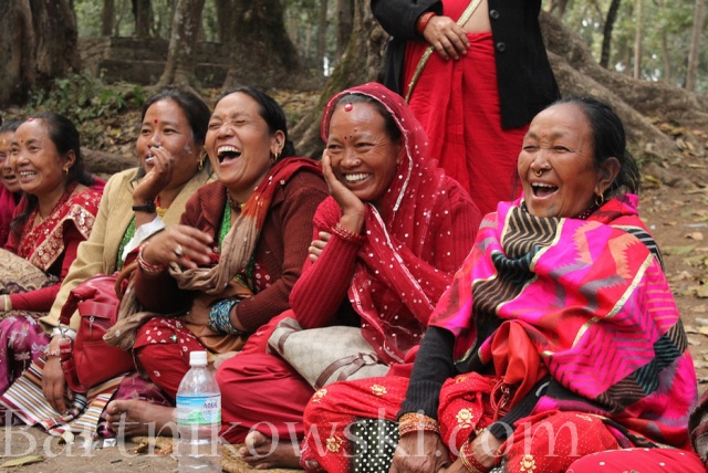 Women Laughing while their Friends are Playing a Game at the Picnic